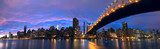 NYC Queensboro Bridge and Manhattan skyline panorama at dusk 